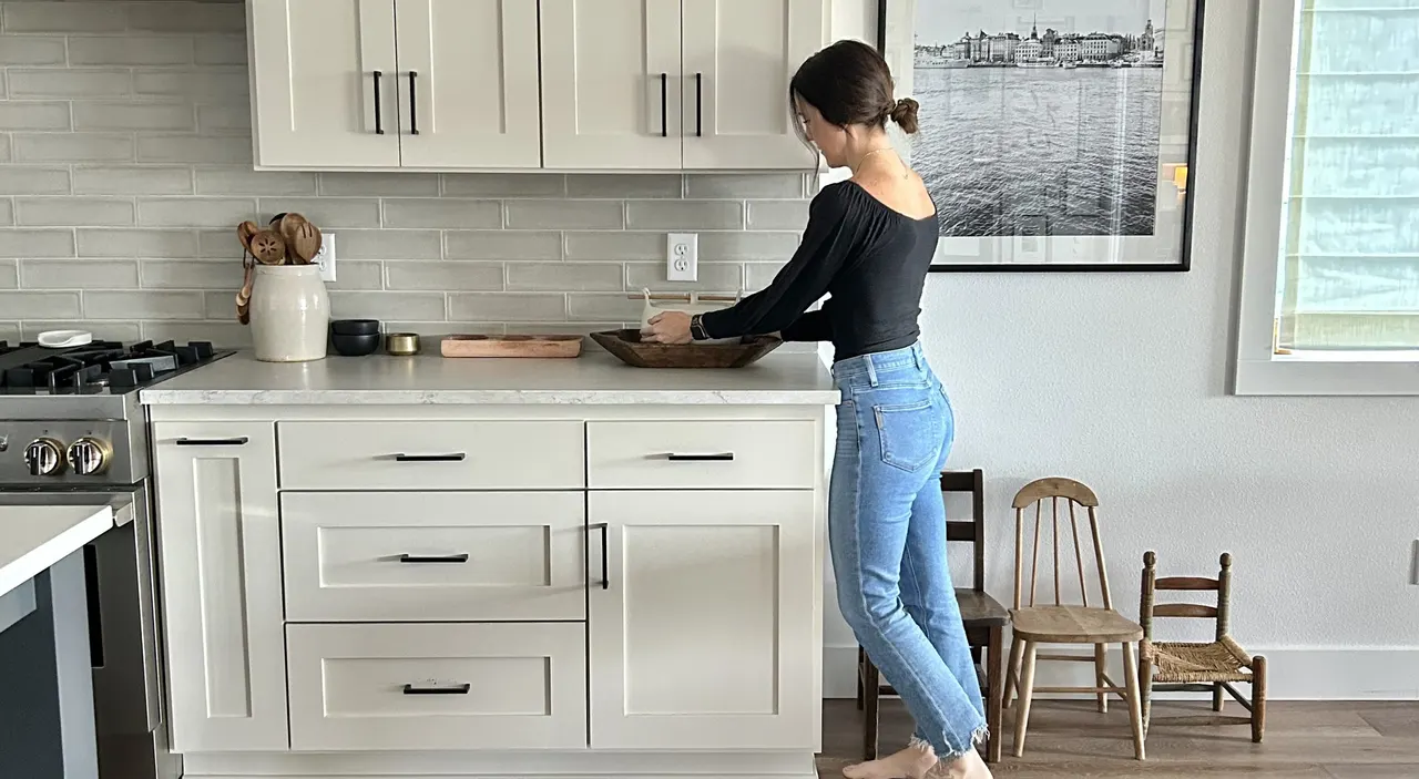 A Design Club designer styling a kitchen counter